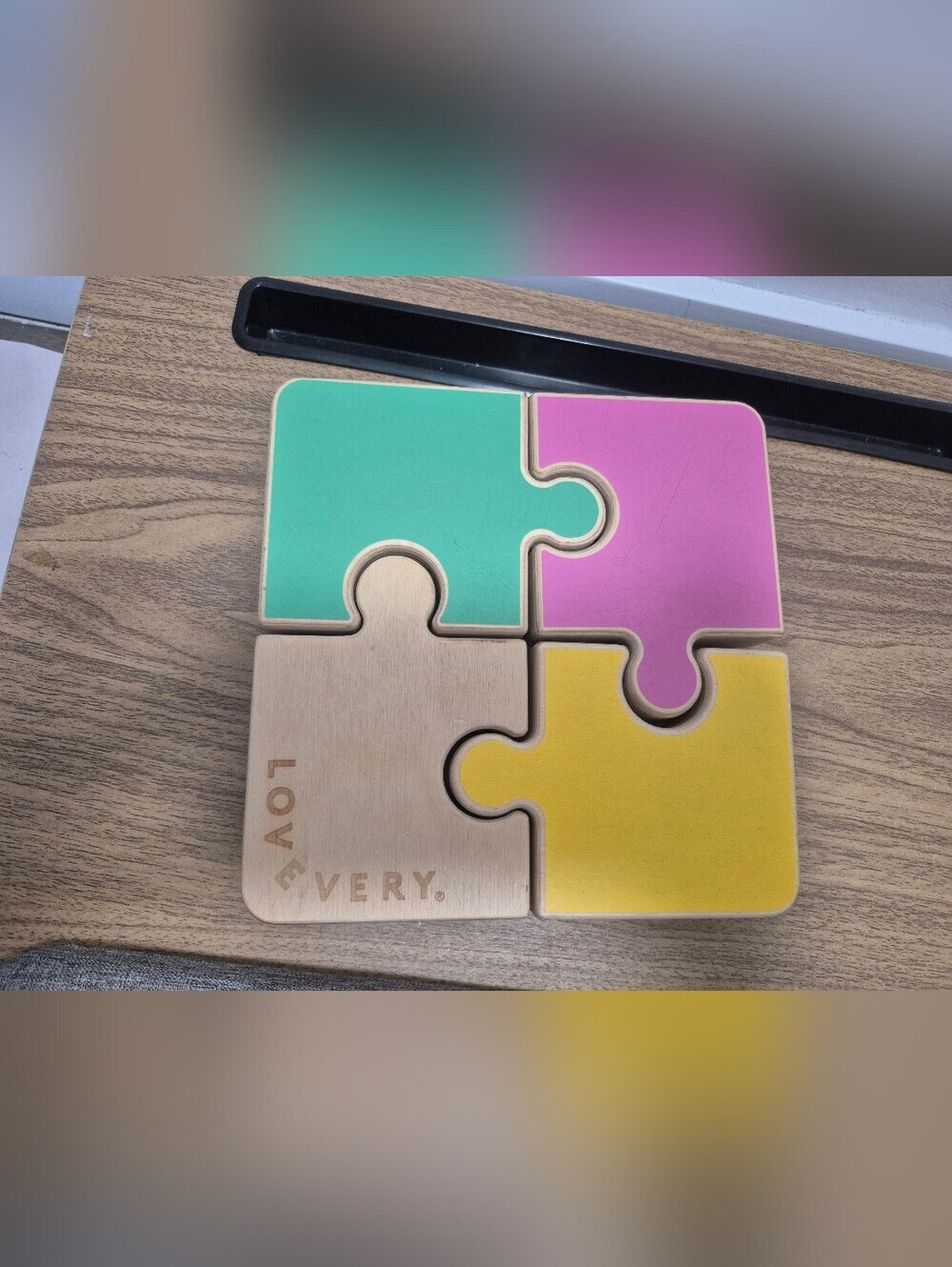 Lovevery Chunky Wooden Jigsaw Puzzle featuring reversible pastelpieces.